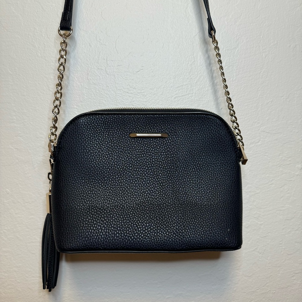 Black cross-body purse with gold detailing